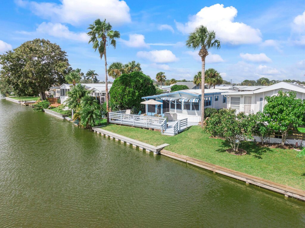Melbourne-441-N-Harbor-City-Blvd-Aerial-real-estate-photography-over-water-back-home
